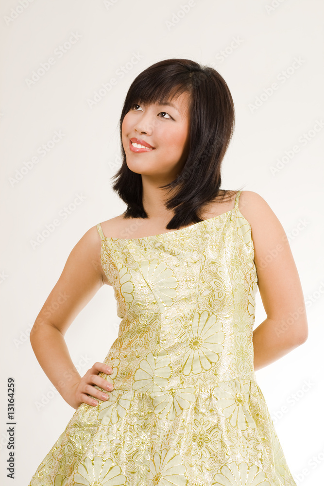 Cute asian women in gold evening dress Cute asian women in gold evening dress