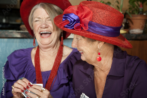 Photography Ladies wearing red hats playing cards