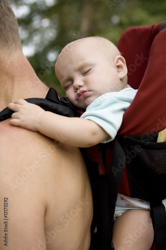 little cute girl sleaping in sling. photo