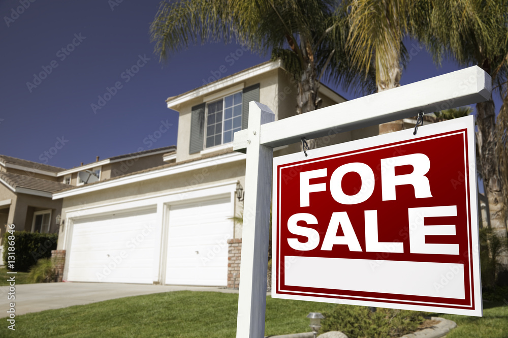 For Sale Real Estate Sign and House