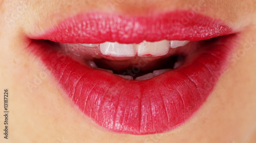 close up of beautiful woman's red lips photo