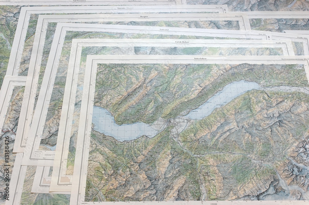 Fototapeta premium Many topo map sheets on top of each other