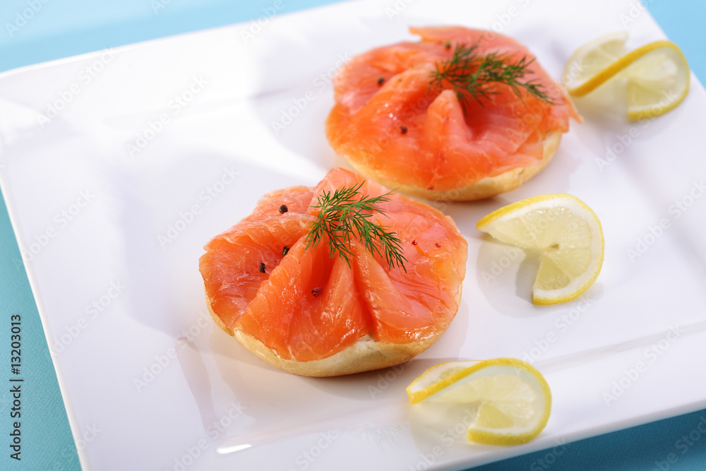 Smoked salmon on bagel with fresh black pepper. Smoked salmon on bagel with fresh black pepper.