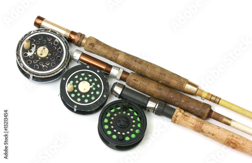 Three old fly fishing rods and reels