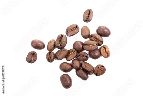 Brown roasted coffee beans isolated on white background.