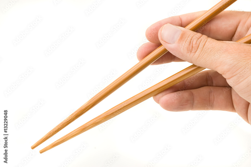 Hand holding chopsticks. Hand holding chopsticks.