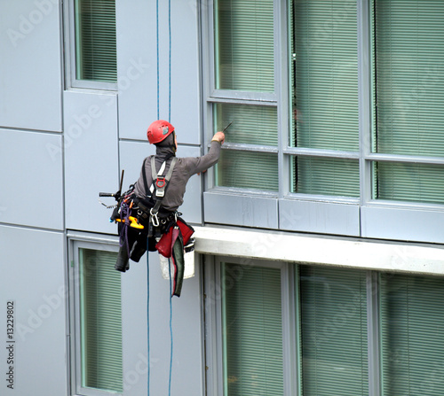Window washer rappelling in a residential building