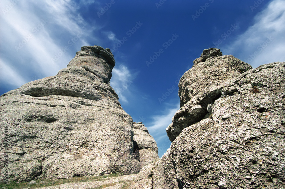 Fototapeta premium Stone formations on blue sky background.
