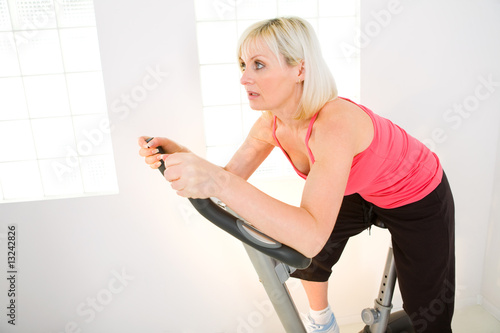 Woman working out on spinning bike