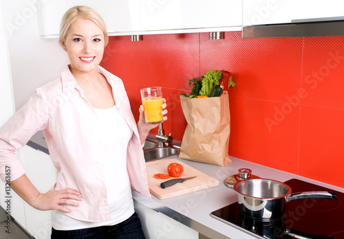 Young woman standing in kitchen