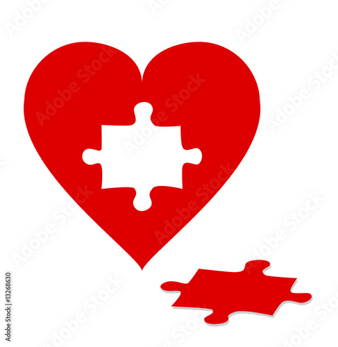 Jigsaw puzzle with red heart isolated on white background