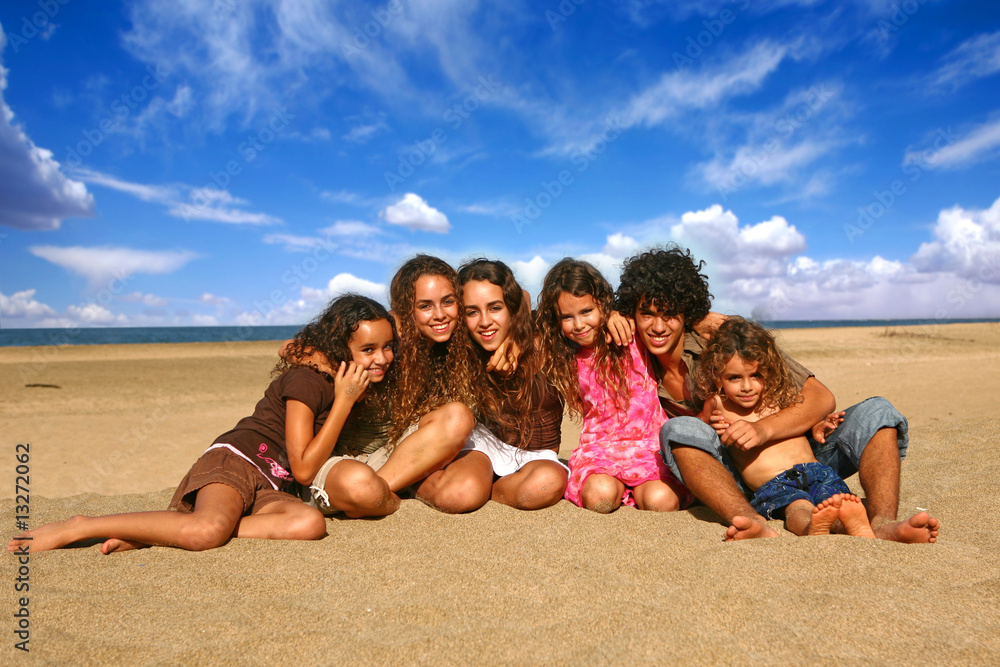 6 Happy Brothers and Sisters Smiling Outdoors at the Beach 6 Happy Brothers and Sisters Smiling Outdoors at the Beach
