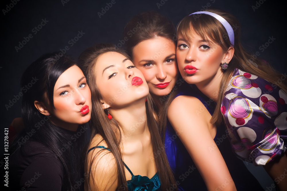 Four woman showing kiss sign
