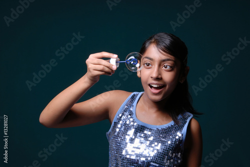 Girl holding a soap bubble