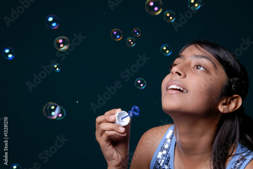 Girl blowing lots of bubbles