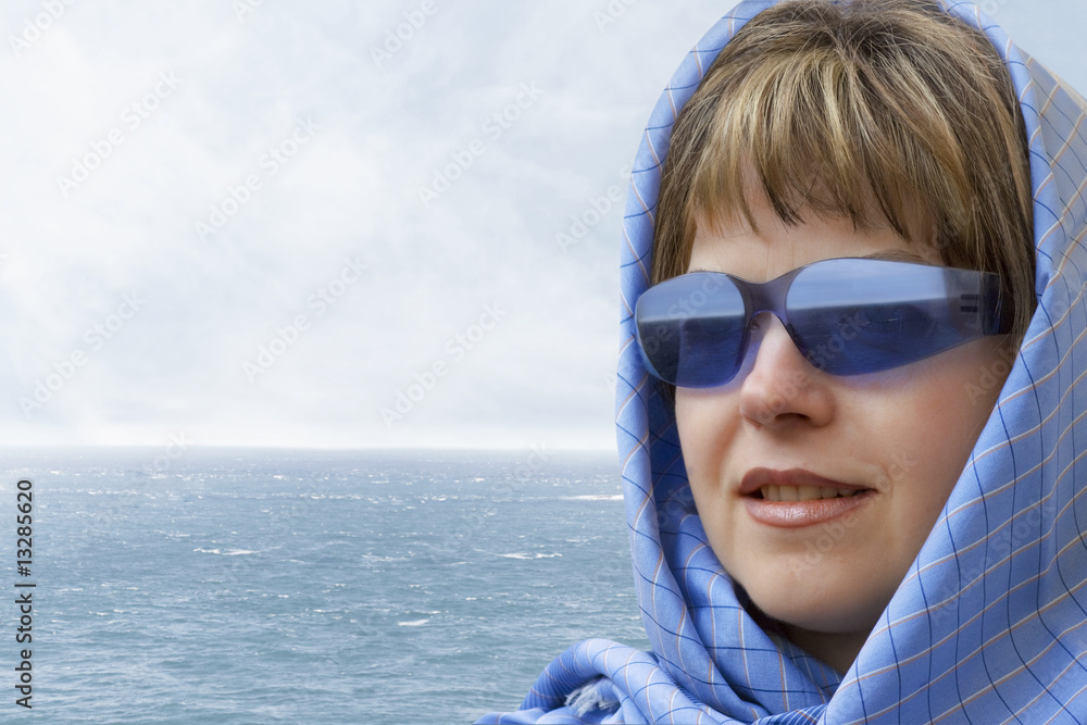 Portrai of a young woman looking out over the sea Portrai of a young woman looking out over the sea