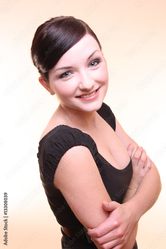 Smiling confident young woman with arms crossed Smiling confident young woman with arms crossed