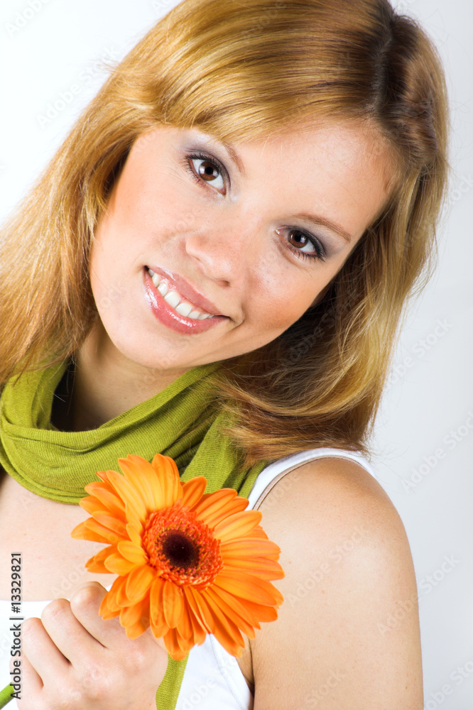 Beauty portrait of a young woman with a flower Beauty portrait of a young woman with a flower