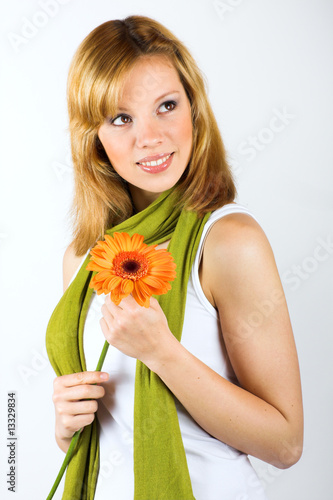 Beauty portrait of a young woman with a flower