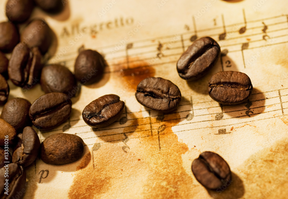 Fototapeta Coffee beans on a grungy musical background