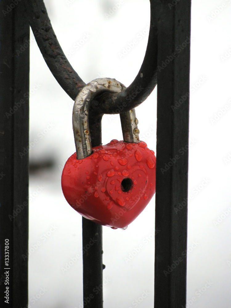 Red heart lock with the drops of rain Red heart lock with the drops of rain