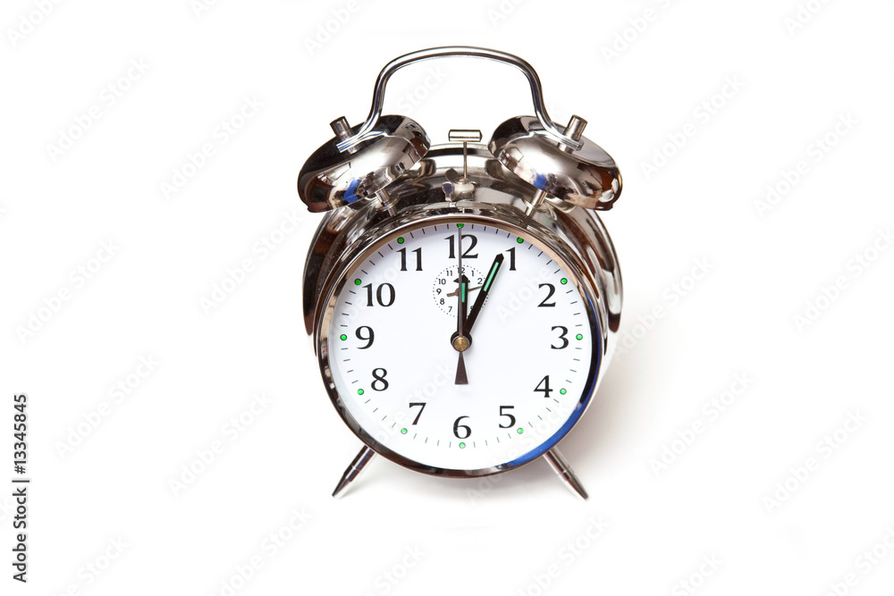 Traditional alarm clock isolated on a white background. Traditional alarm clock isolated on a white background.