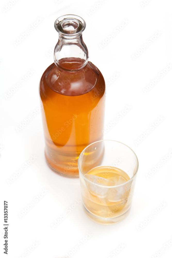 Bottle of Scotch whiskey isolated on a white studio background. Bottle of Scotch whiskey isolated on a white studio background.