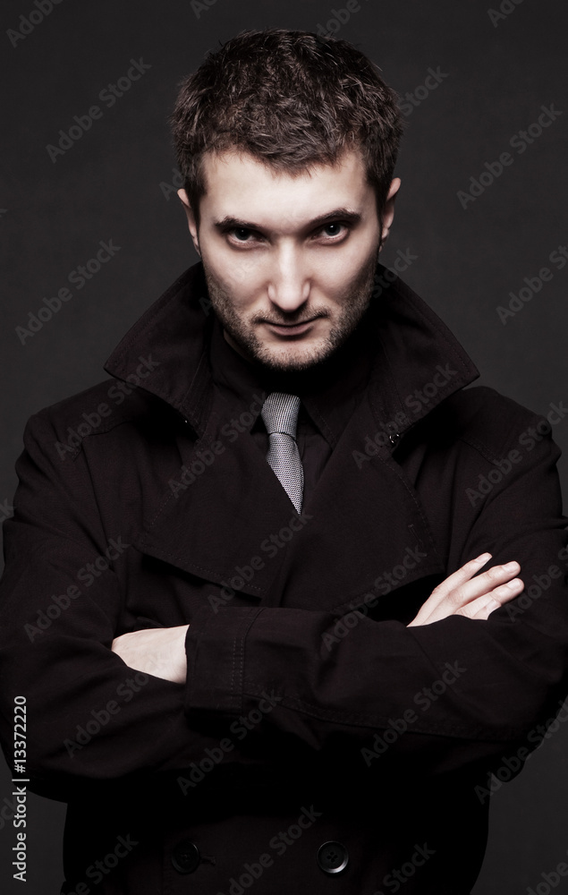 portrait of stern man in black coat portrait of stern man in black coat