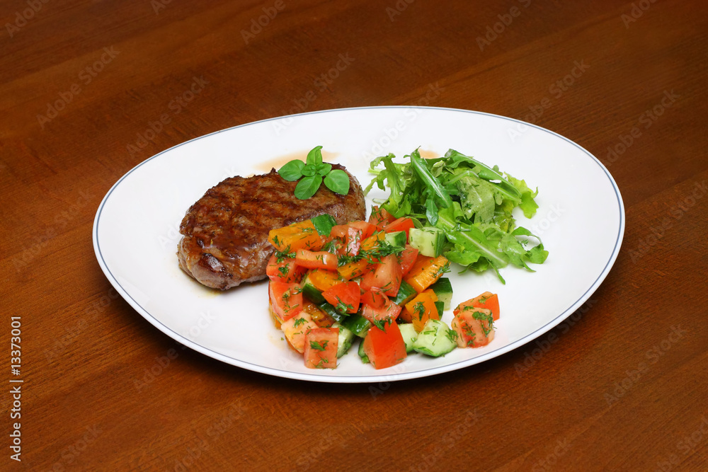 Plate with the cutlet and vegetables, salad and spices Plate with the cutlet and vegetables, salad and spices
