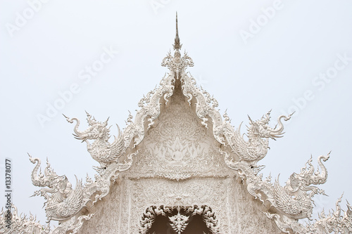 Details of top front of famous white church of Wat Rong Khun