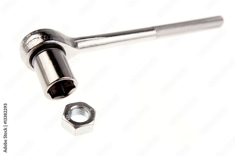 Wrench and nut isolated over white Wrench and nut isolated over white