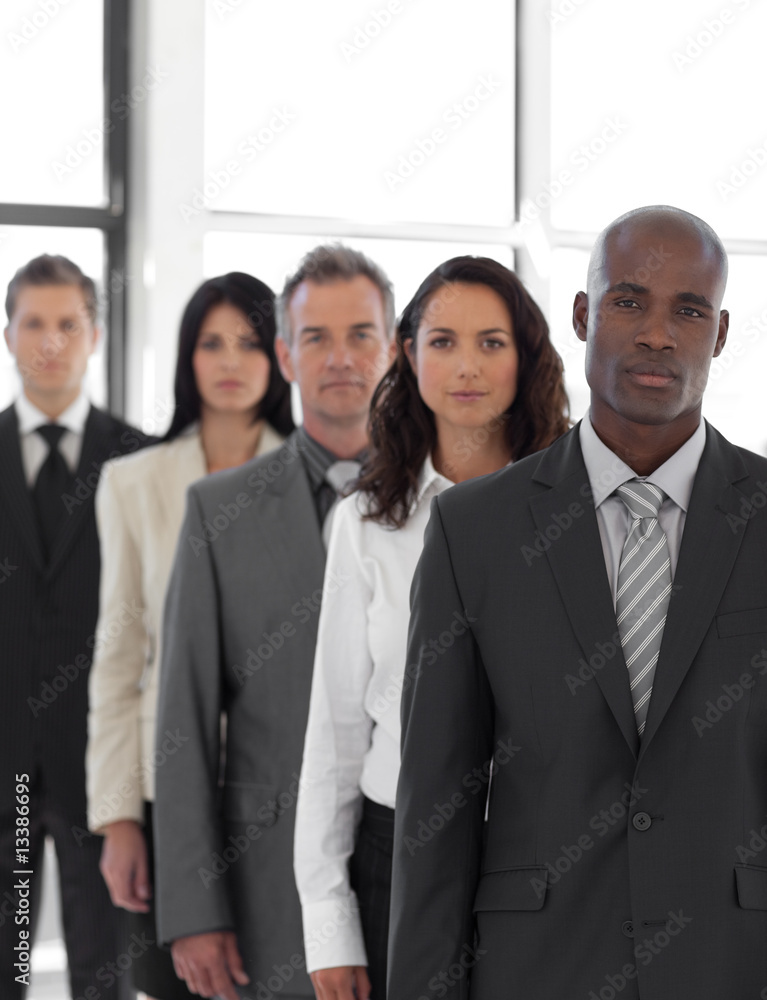 Serious business leader in front of business tea