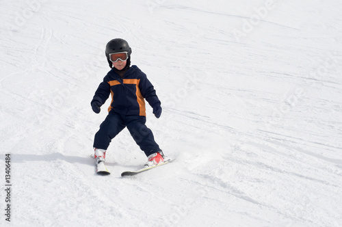 Four year old child skiing alone