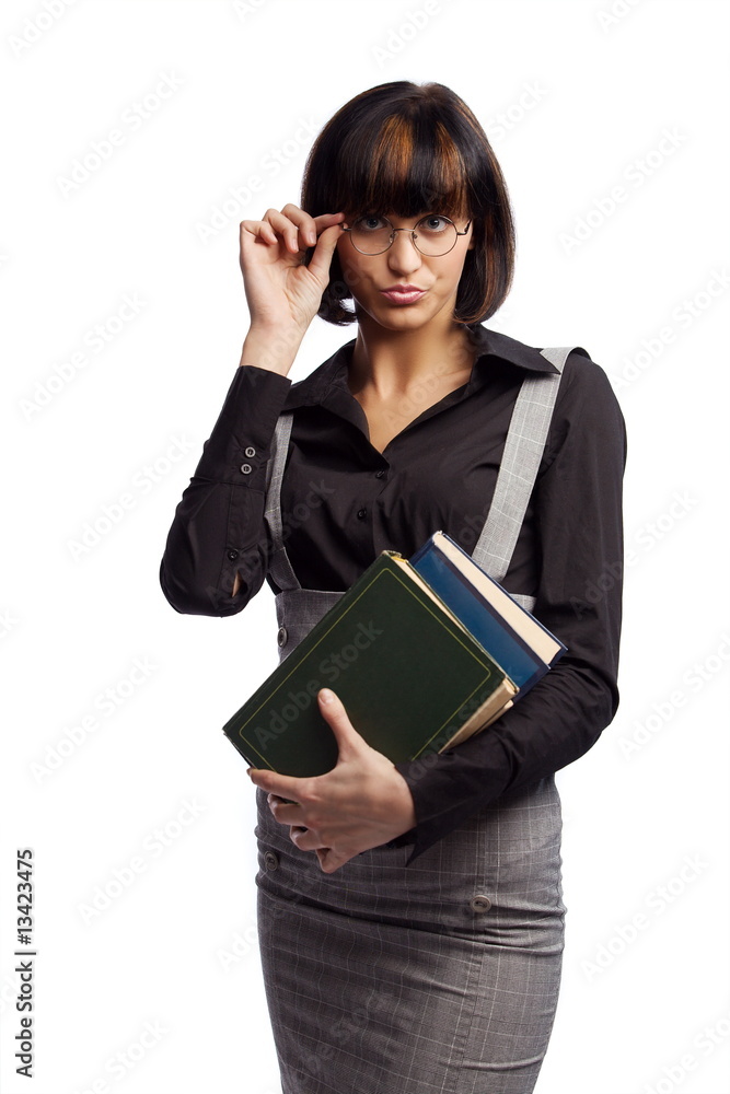 Haughty brunette schoolgirl hold books in the hands Haughty brunette schoolgirl hold books in the hands