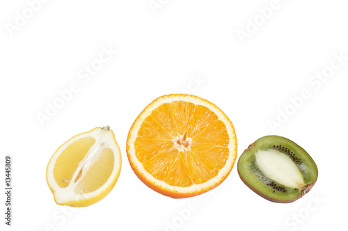 Pieces of fresh citrus on a white.