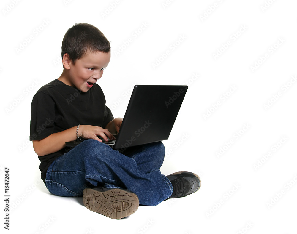 Young Child Working on Laptop Computer Young Child Working on Laptop Computer