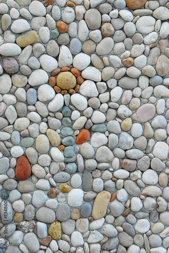 Flower shaped by pebbles in natural colors. Vertical photo with copy space. Flower shaped by pebbles in natural colors. Vertical photo with copy space.