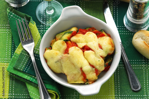 Zucchine gratinate con mozzarella al pomodoro photo