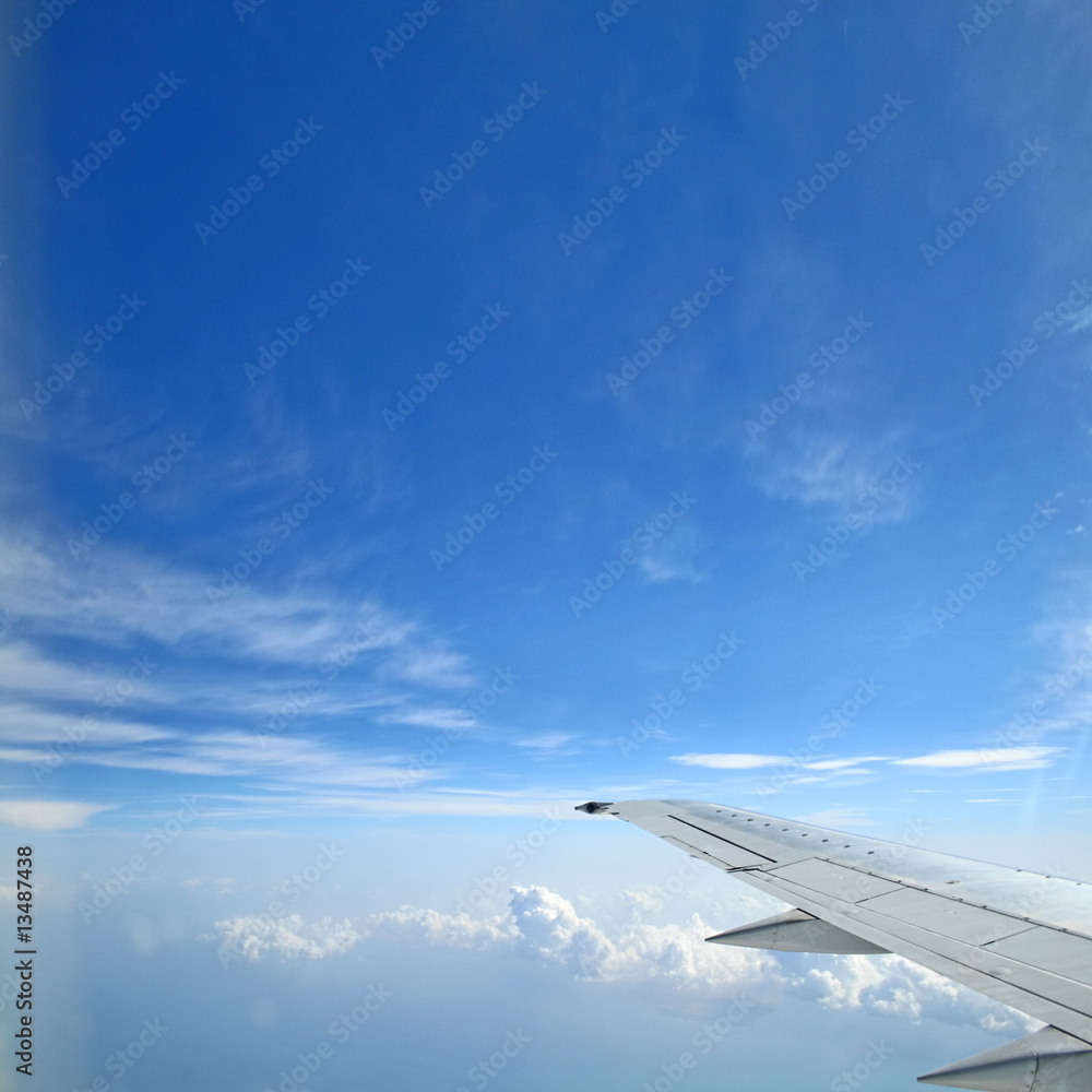 View from a plane to the wing ans clouds