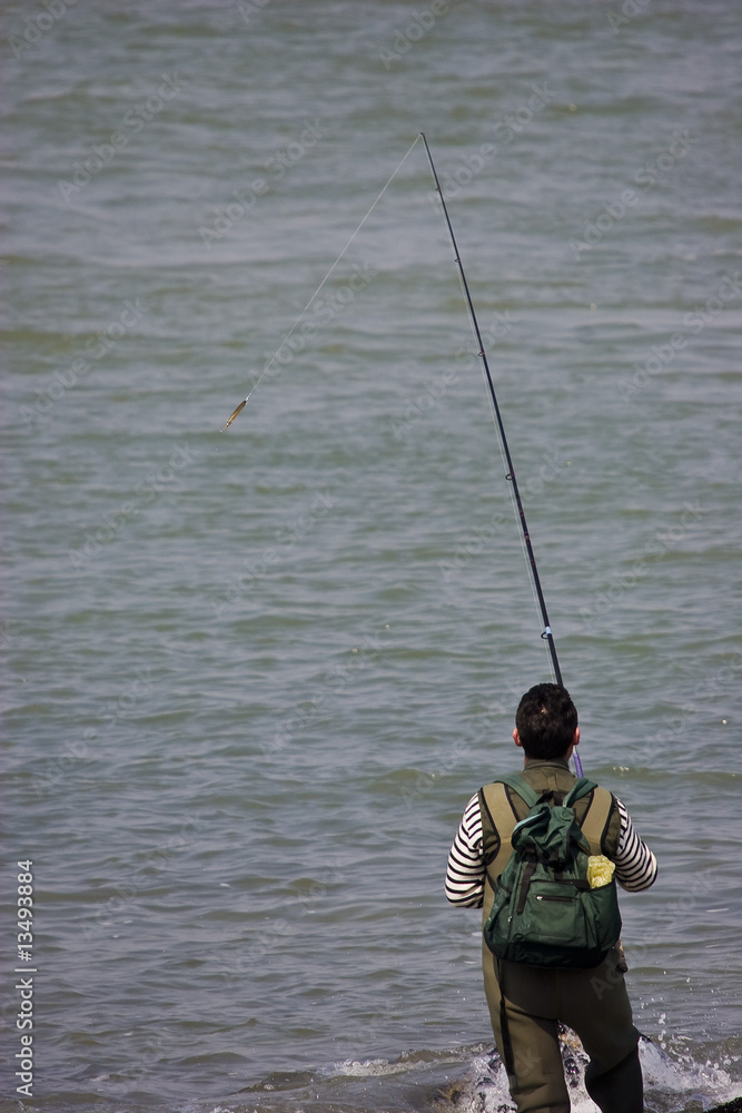 a man fishing in the sea