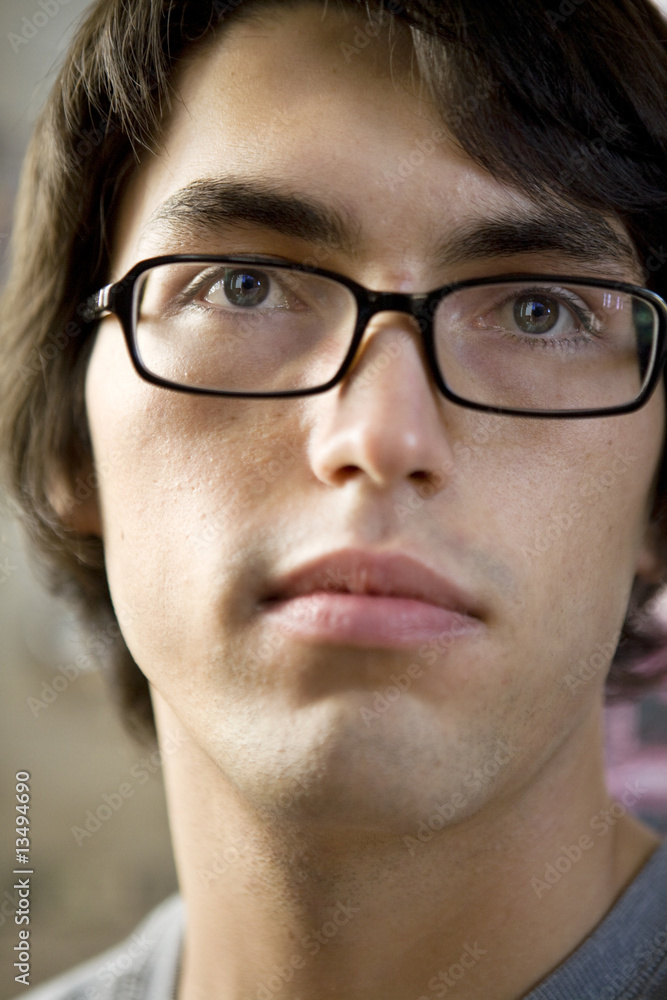 close up portrait of young serious handsome man. close up portrait of young serious handsome man.