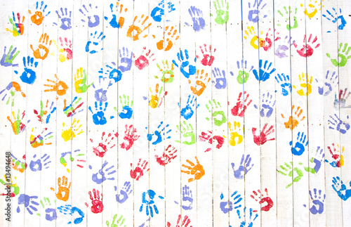 Colorful handprints on a wall