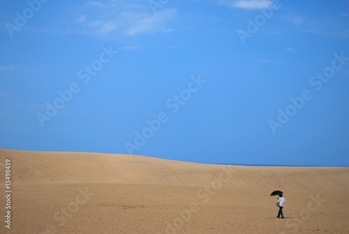 Woman alone in desert © gnohz