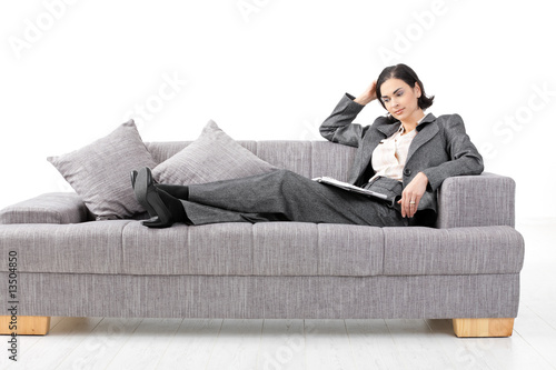 Businesswoman sitting in sofa