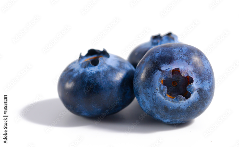 Blueberry on a white background. Macro, shallow focus. Blueberry on a white background. Macro, shallow focus.