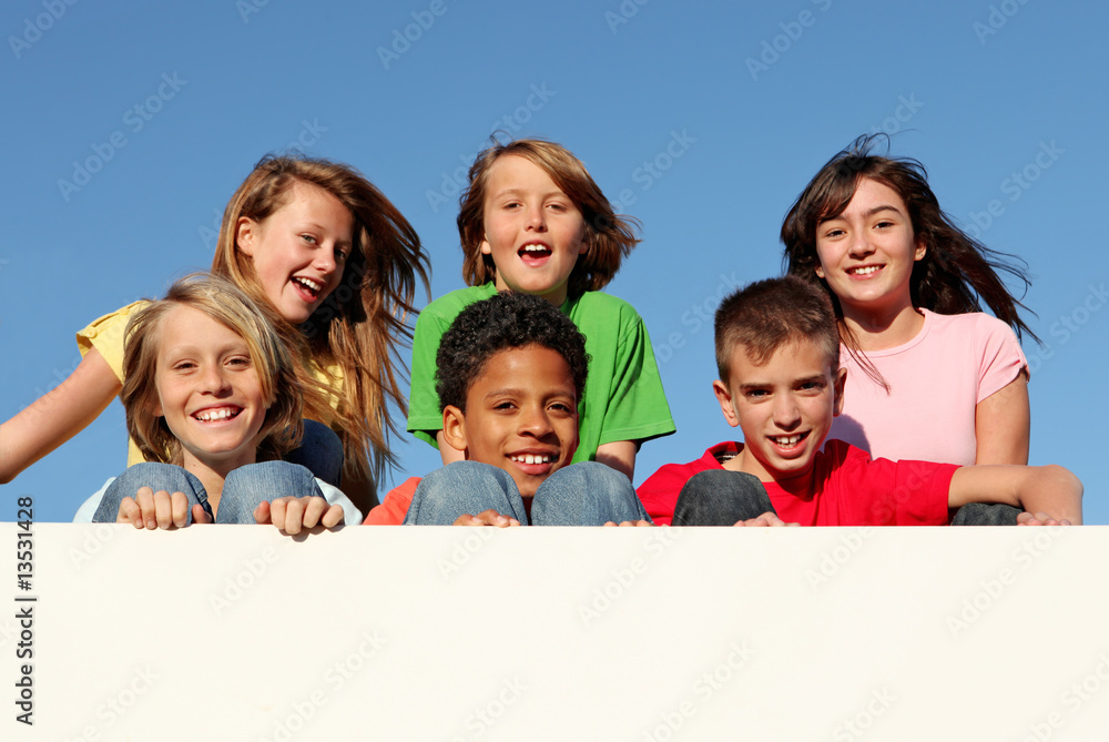 diverse group of kids holding banner at summer camp diverse group of kids holding banner at summer camp
