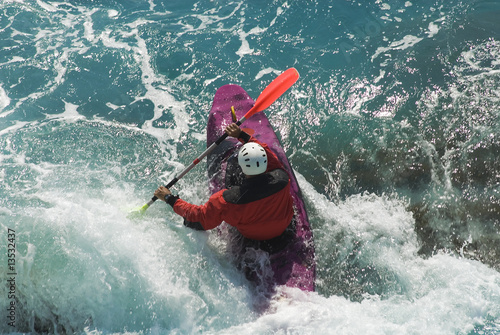kayak on the wawes of the sea