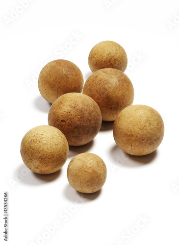 Group of old wooden balls for bowling isolated on white