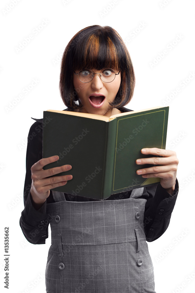 Shocked brunette schoolgirl looking in the book Shocked brunette schoolgirl looking in the book