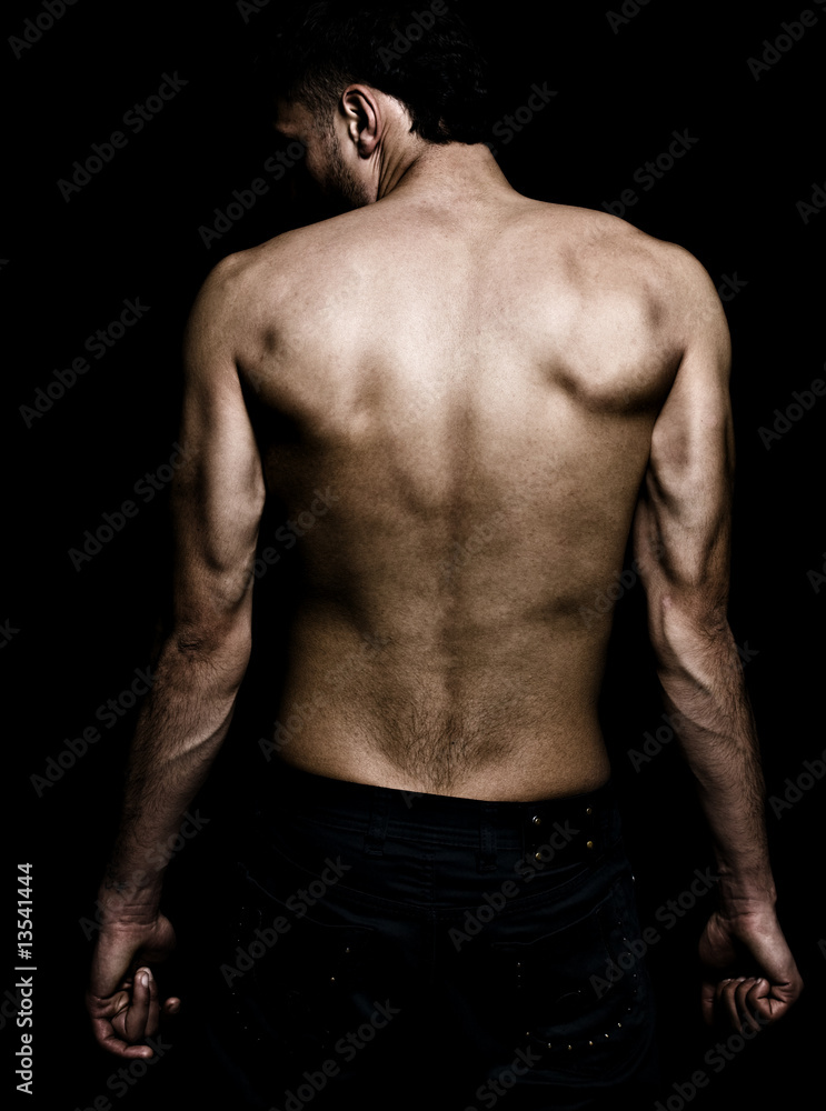 Artistic grunge image of man with muscular back Artistic grunge image of man with muscular back
